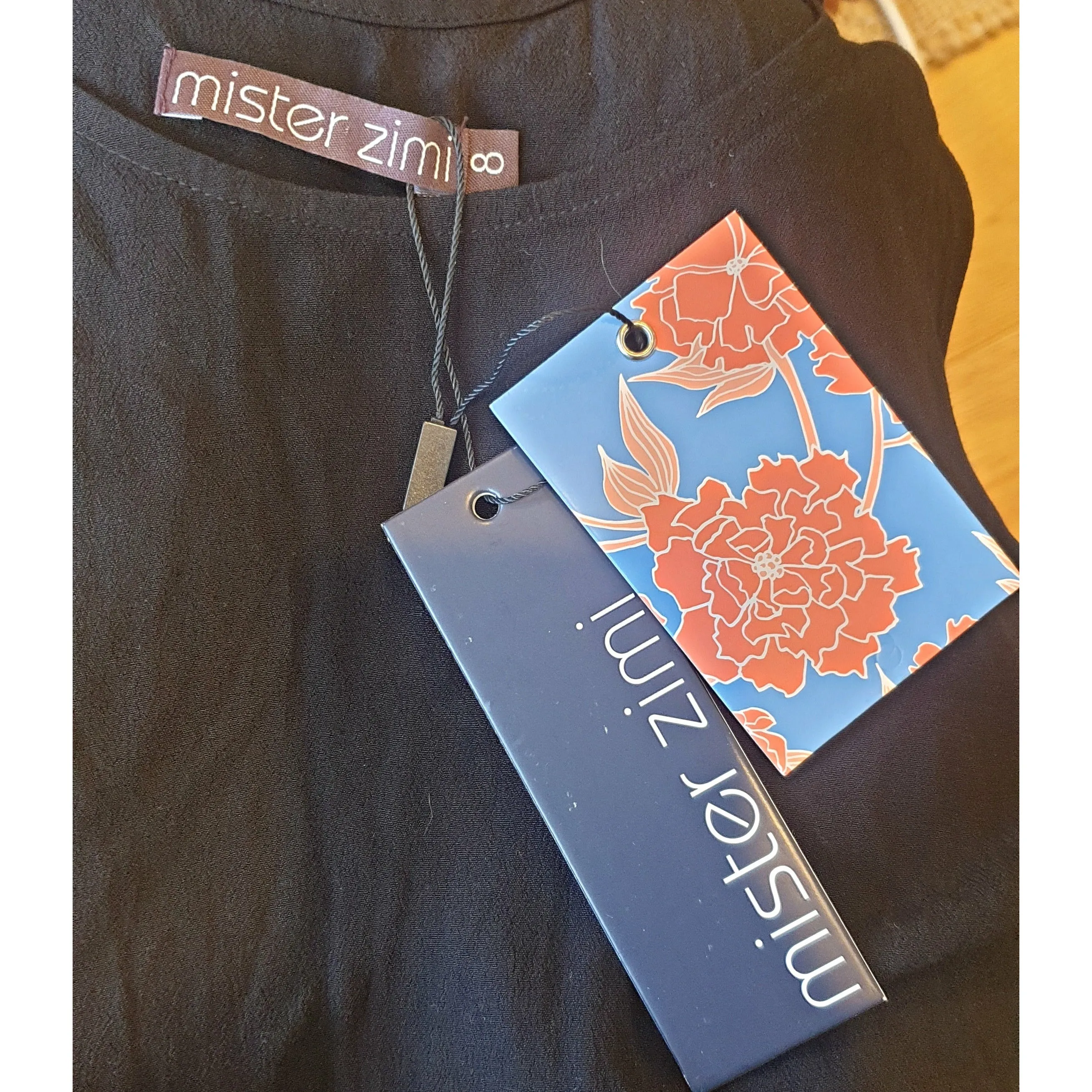 Mister Zimi black sleeveless top with flowy bottom detail size 8