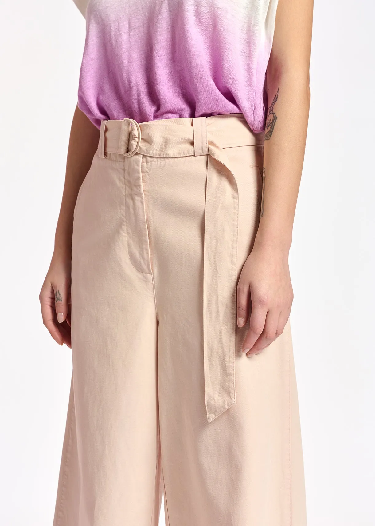 Powder pink belted high-waisted wide-leg jeans